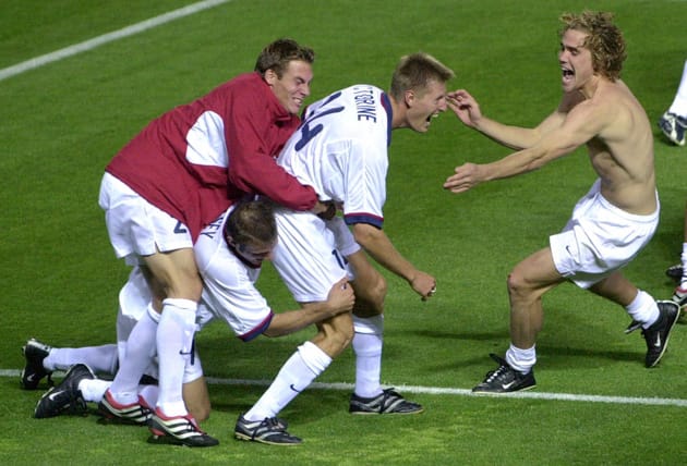 From left, Brian Dunseth, Conor Casey, Sasha Victorine and Chris Albright celebrate the USA's Olympic quarterfinal win over Japan after a PK shootout.